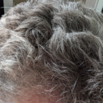 My gray hair now would have been a liability then.